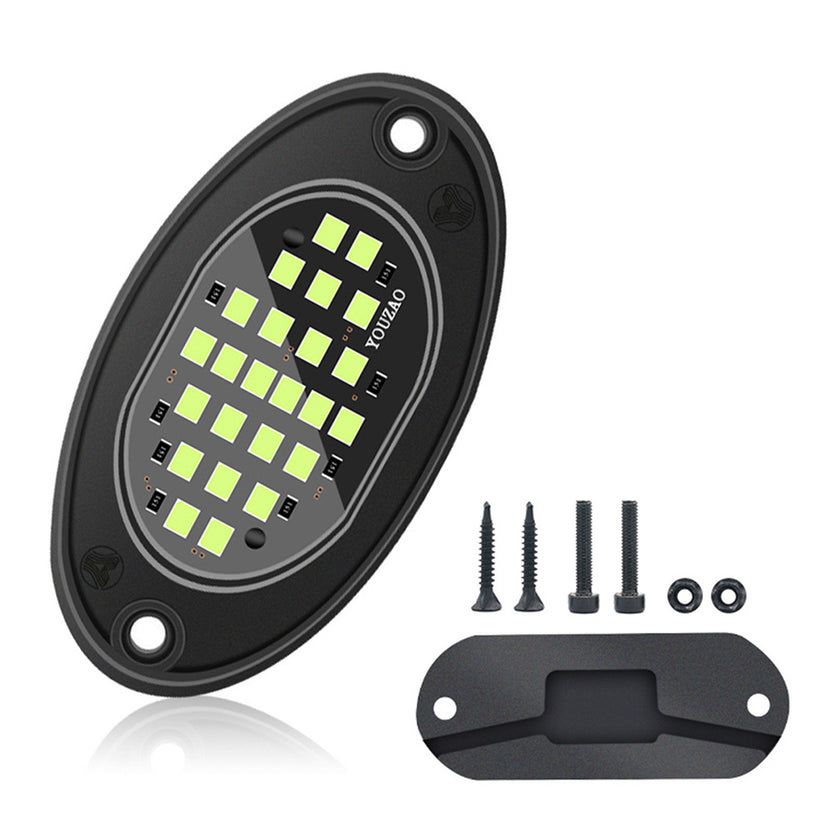 Oval underbody LED pod light with its mounting bracket and screws