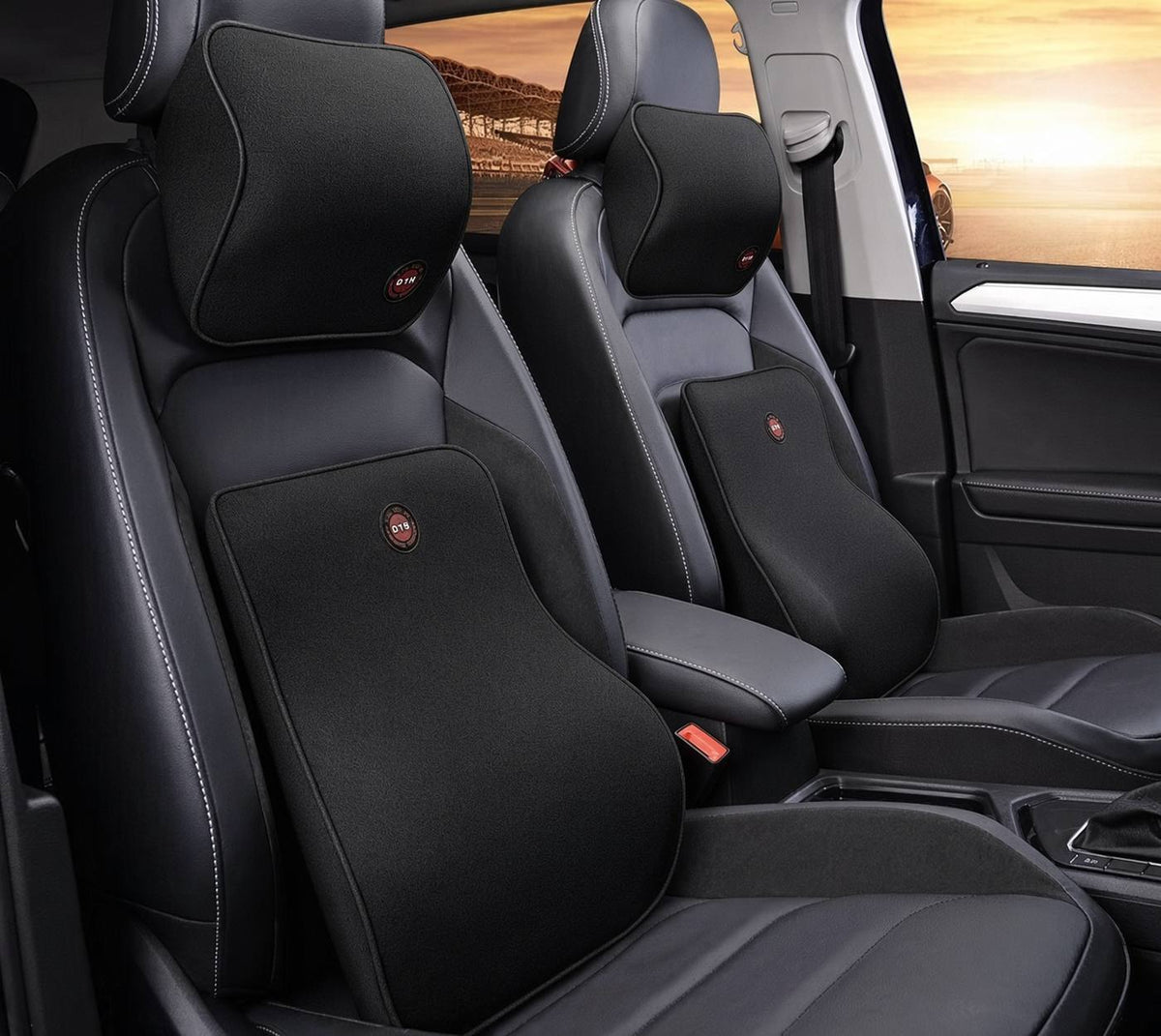 Black memory foam car headrest and lumbar support pillow set installed in a car
