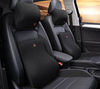 Black memory foam car headrest and lumbar support pillow set installed in a car