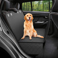 Dog sitting on the PawDeck hammock covering a car rear bench
