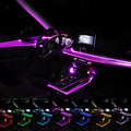 Starfall fiber optic light installed across a car dashboard and door trim at night