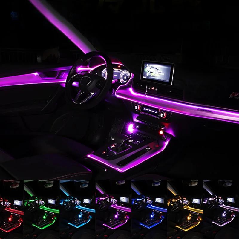 Fiber optic light running along the dashboard and door trim of a car interior at night