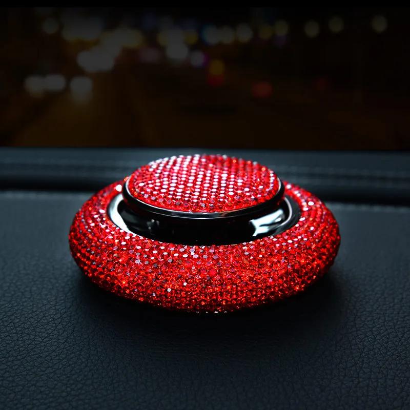 Prism crystal car fragrance bottle on a dashboard