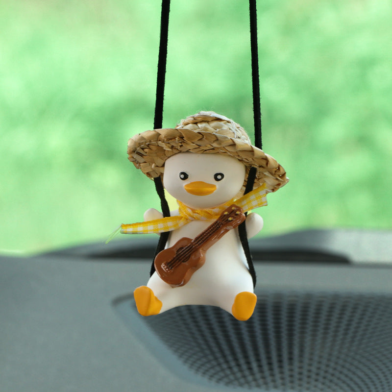 SwingDuck rearview mirror charm — yellow duck with a violin