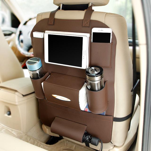 CaddyLux organizer mounted on a car seat holding a tablet, drinks and a phone