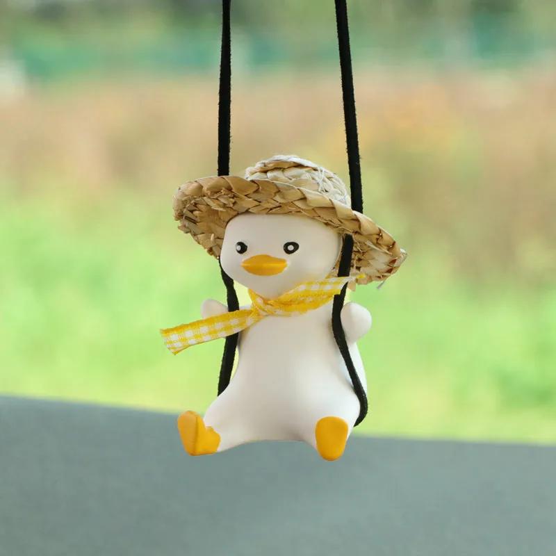 SwingDuck rearview mirror charm — duck in a straw hat