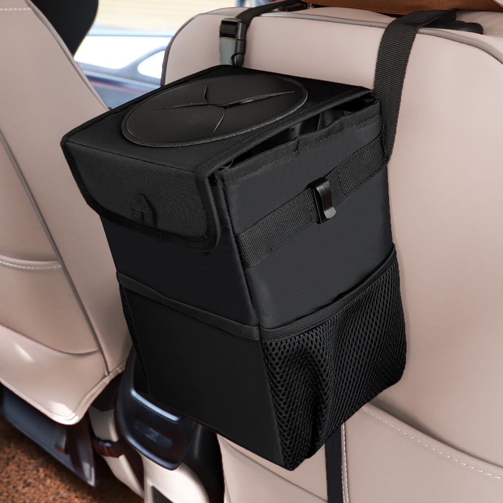 The car bin strapped to the back of a front seat, lid closed