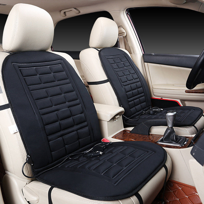 Two black heated seat cushions fitted to the front seats of a car