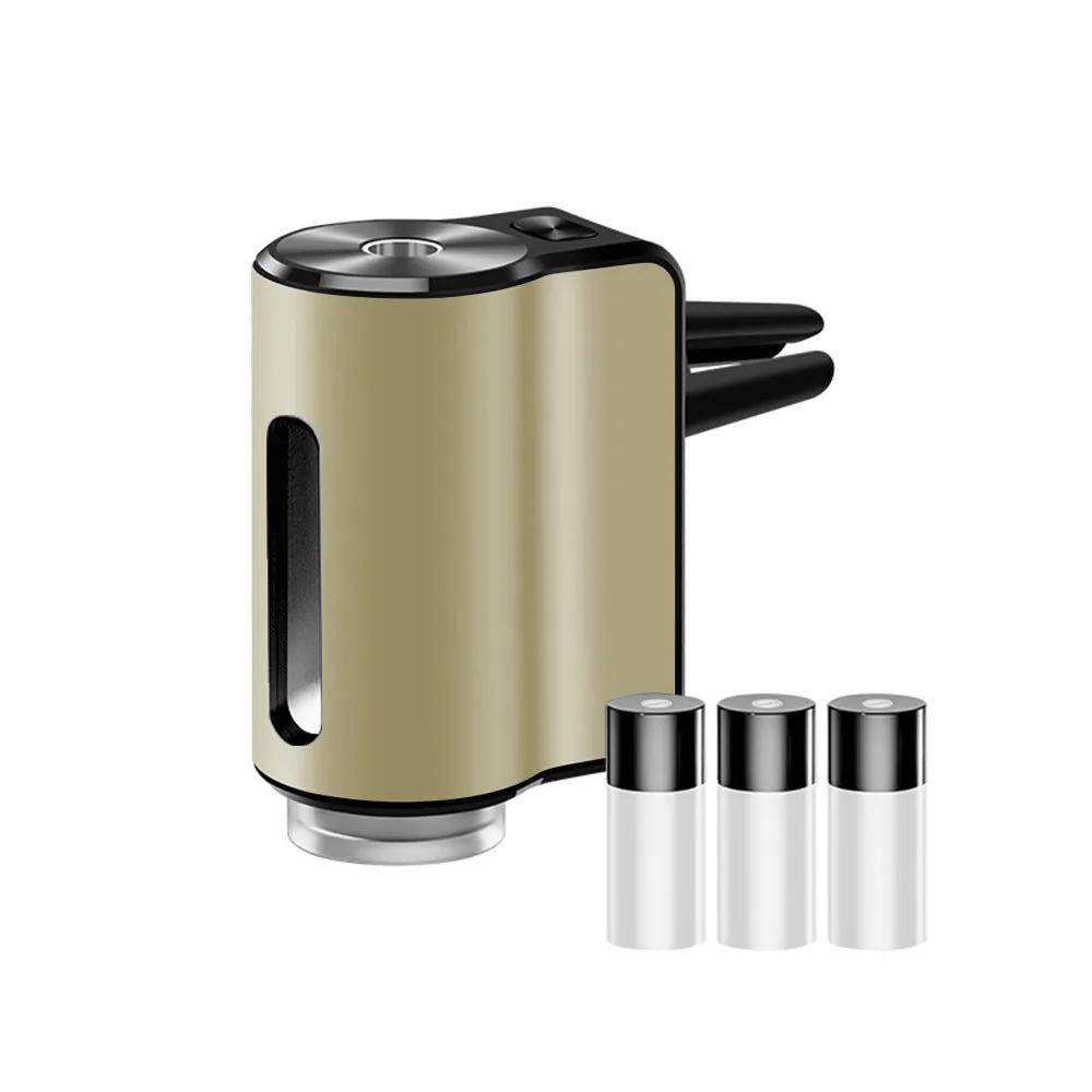 AromaDrive smart car diffuser in champagne gold, with three essential oil bottles