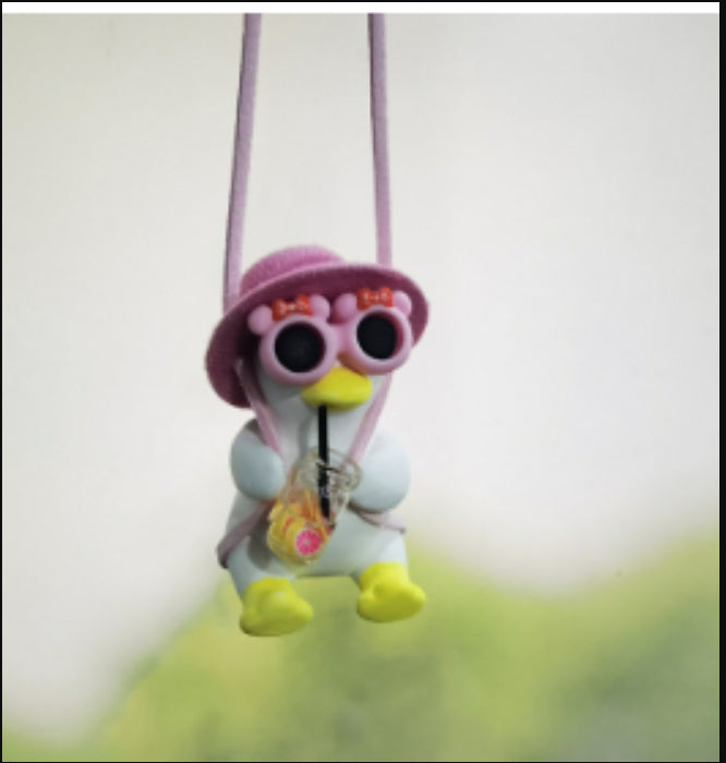 SwingDuck rearview mirror charm — pink duck in a pink hat