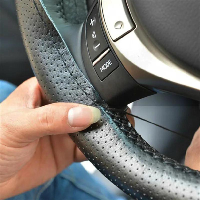 Perforated anti-slip grip detail on the genuine leather wheel cover