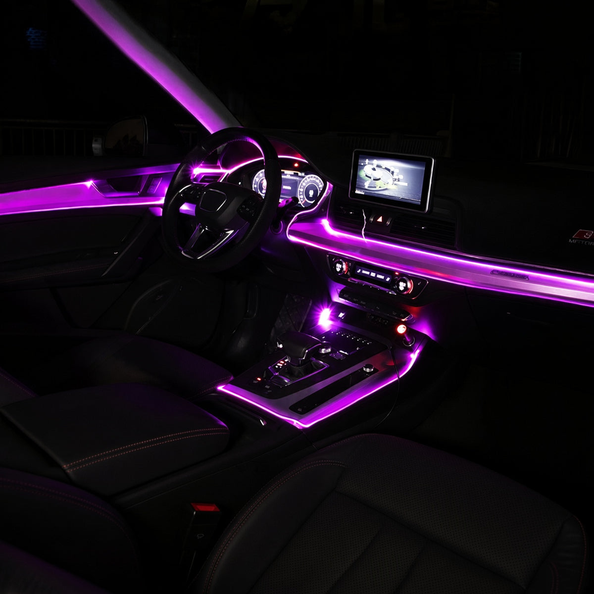 Night cabin with a magenta fiber-optic line tucked into the dash and door seams