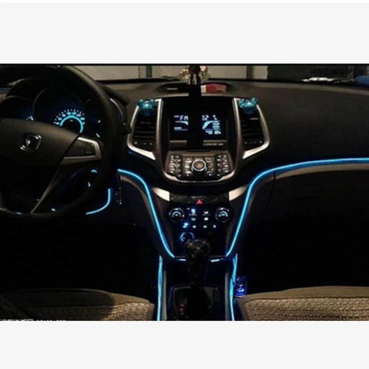 Ice blue neon strip running along the dashboard trim of a car at night