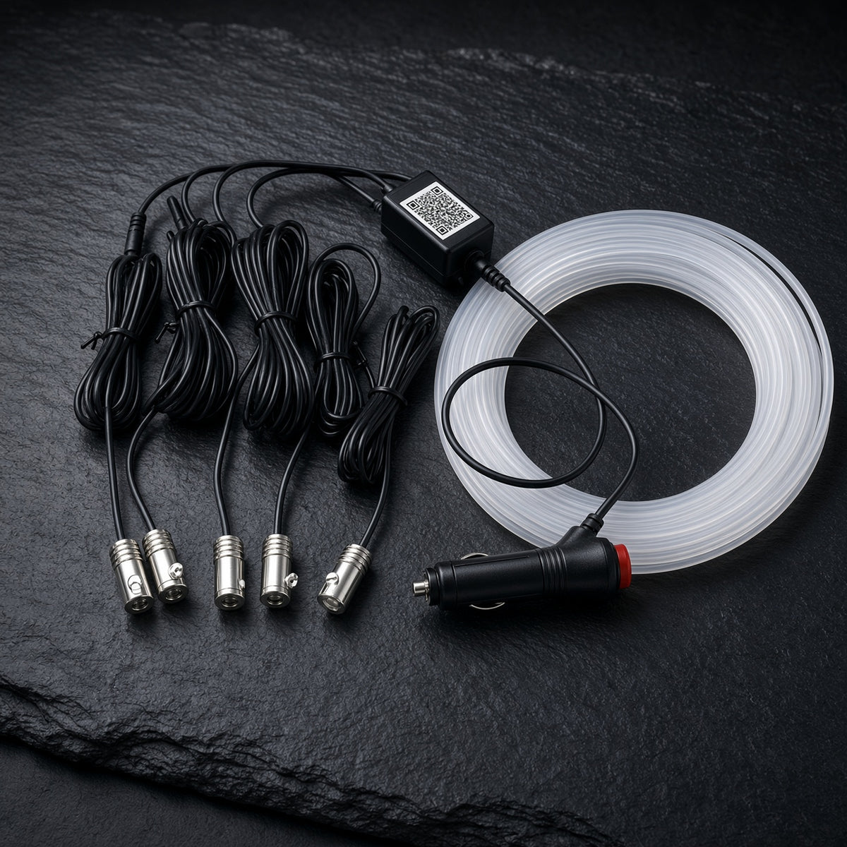 Kit laid out: 12V controller, light engines, fibre spool and cigarette-lighter plug