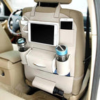 The beige organizer fitted to a seat back in a light interior