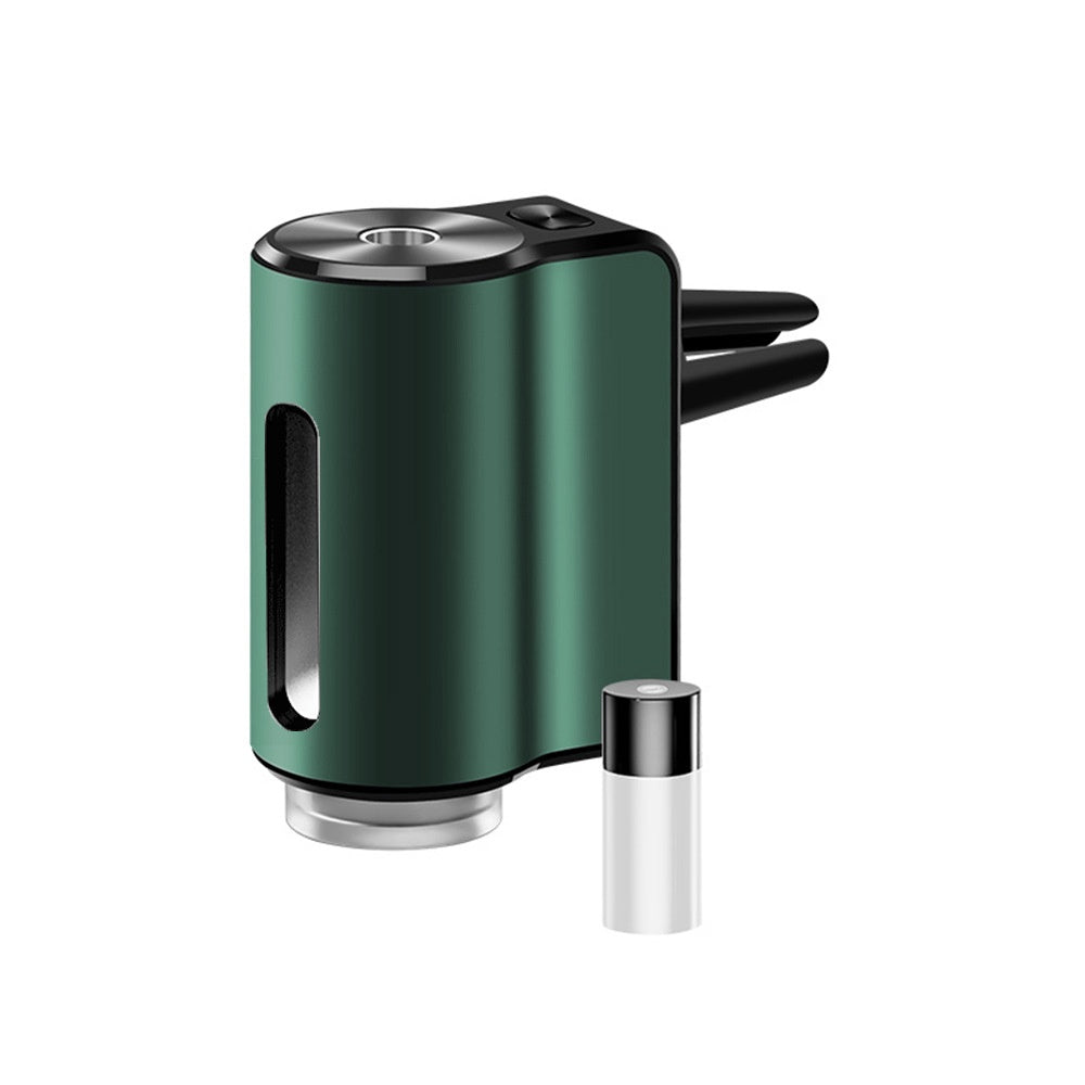 AromaDrive smart car diffuser in dark green, with one essential oil bottle