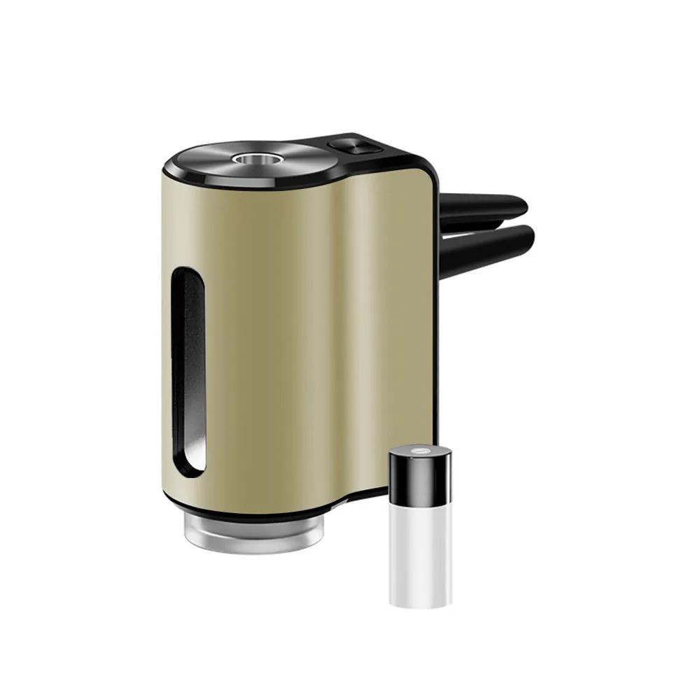 AromaDrive smart car diffuser in champagne gold, with one essential oil bottle