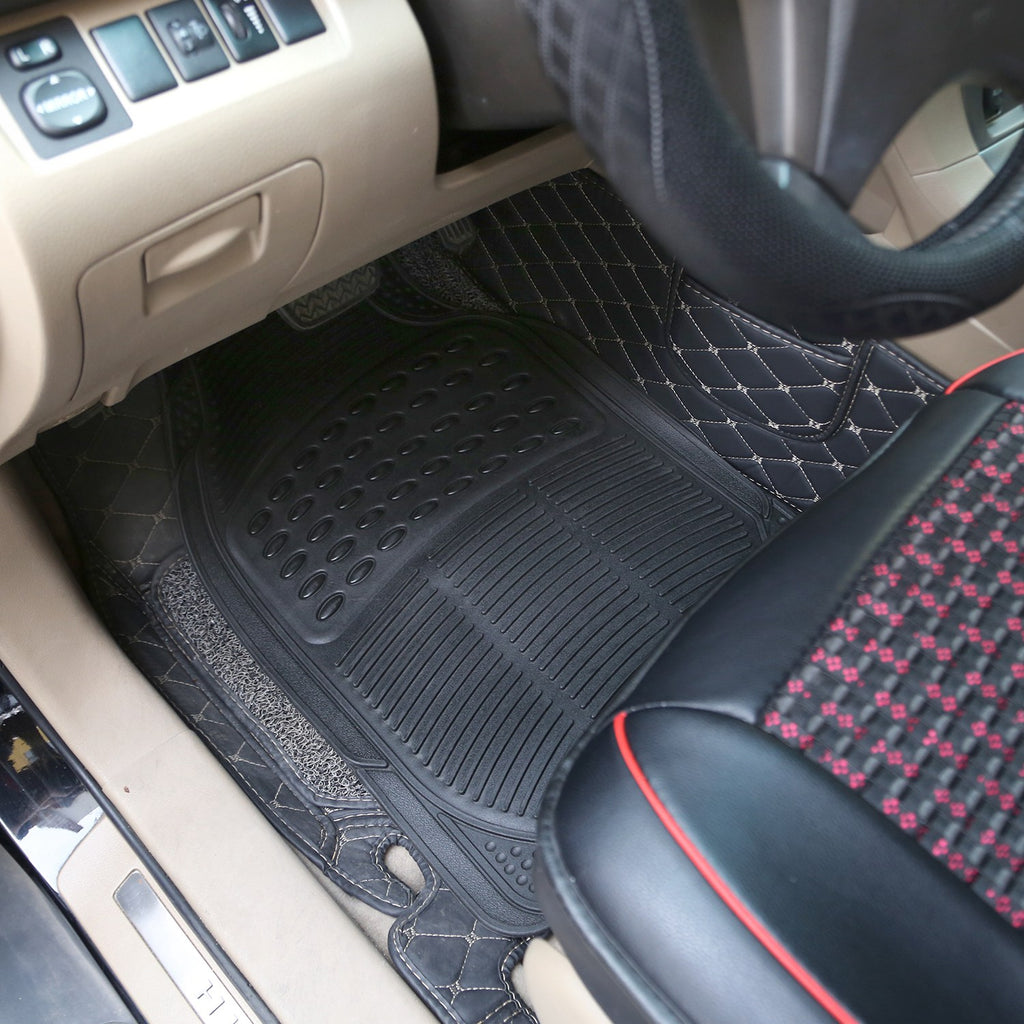 Heavy-duty black rubber car floor mat fitted in the driver's footwell of a car with beige interior