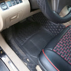 Heavy-duty black rubber car floor mat fitted in the driver's footwell of a car with beige interior