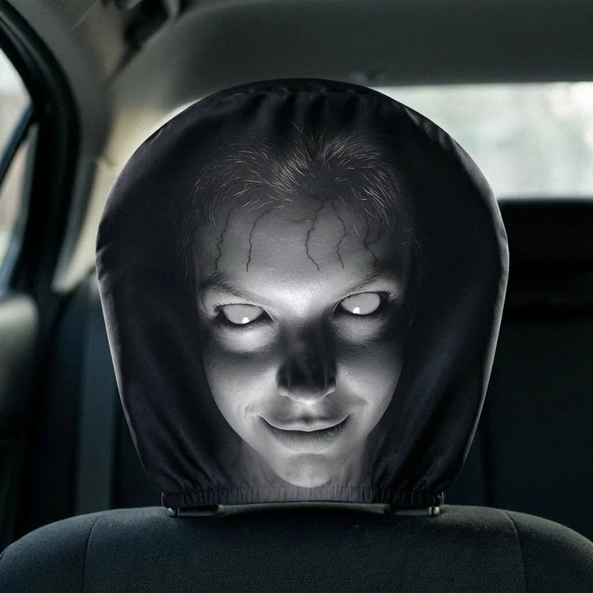 Funny creepy face car headrest cover stretched over a car headrest