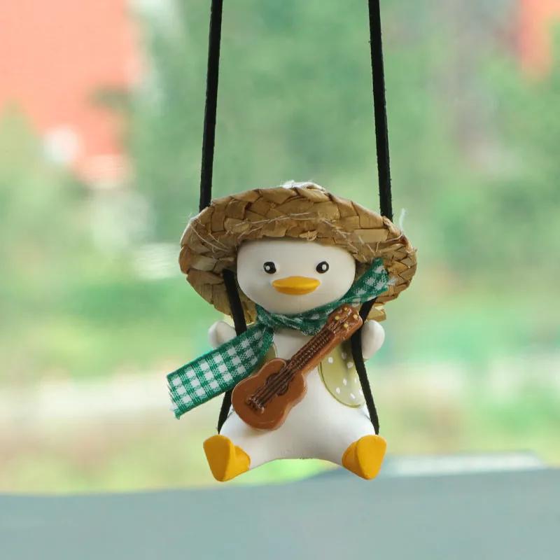 SwingDuck rearview mirror charm — green duck with a violin