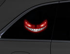 Devil eye window light glowing in a car window at night