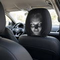 From the back seat: staring-face headrest cover looking back at you