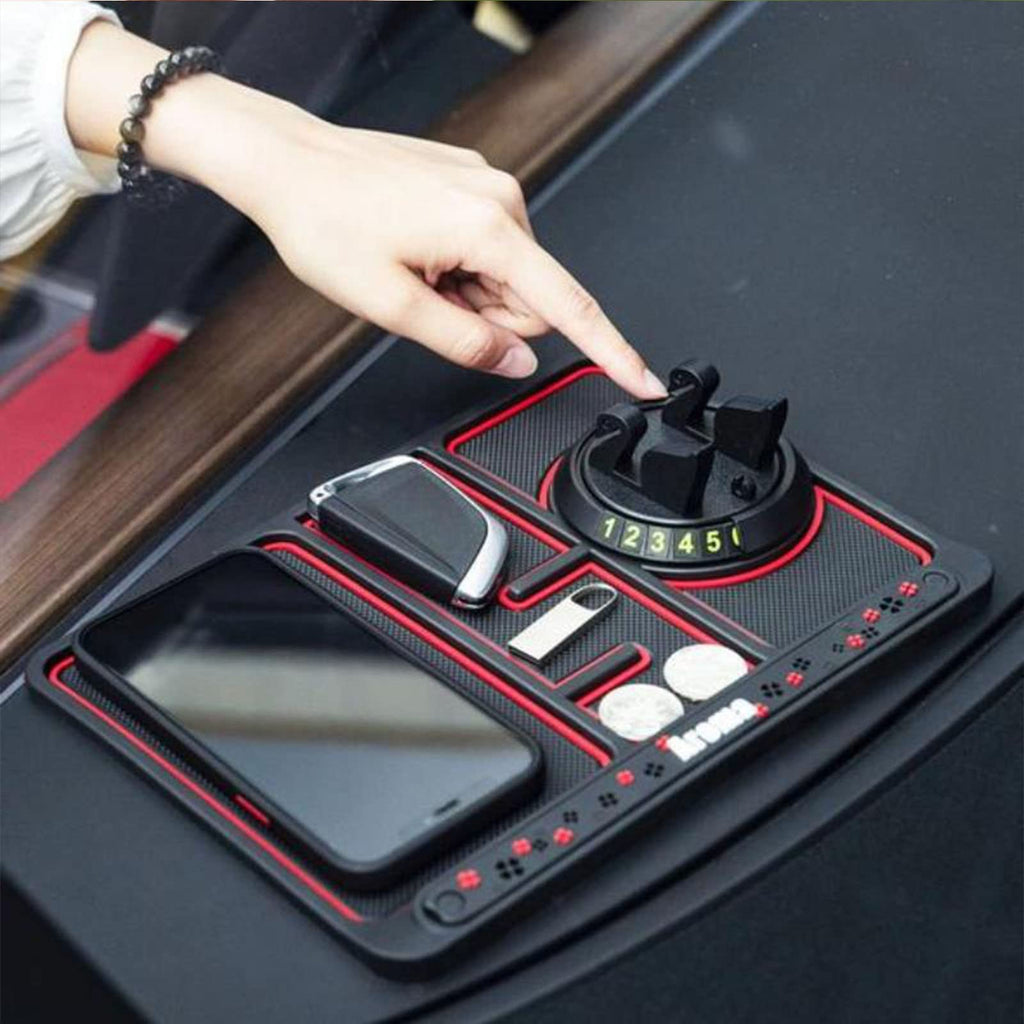 Non-Slip Car Dashboard Mat in use — on the dash holding a phone, key fob and coins, hand adjusting the phone stand