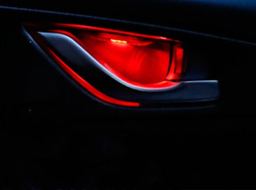LED door bowl light glowing red behind an interior door handle
