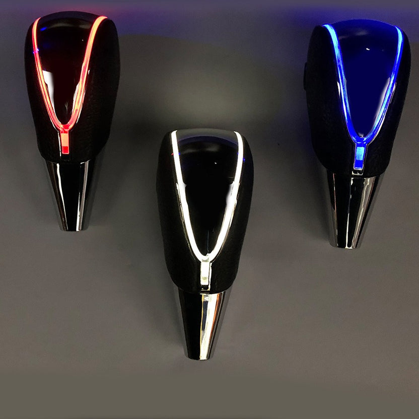 LED gear knobs glowing red, white and blue along the edge