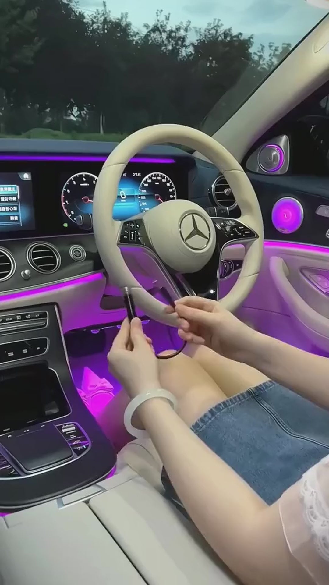 The StarDrive projector being plugged into a car centre console USB port, then the red starfield it throws across the roof lining