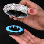 Crystal Car Air Freshener in use — hand unscrewing the white unit to show the refillable balm base