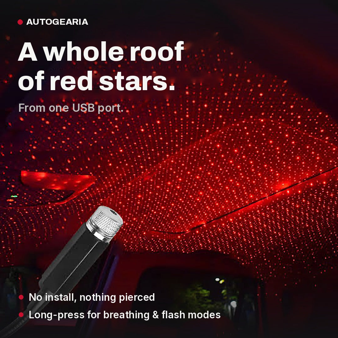 USB star projector filling a car roof lining with a red starfield