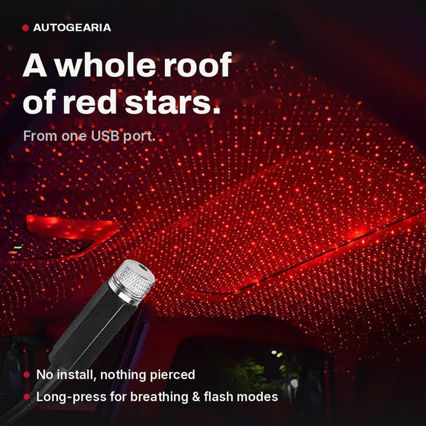 USB star projector filling a car roof lining with a red starfield
