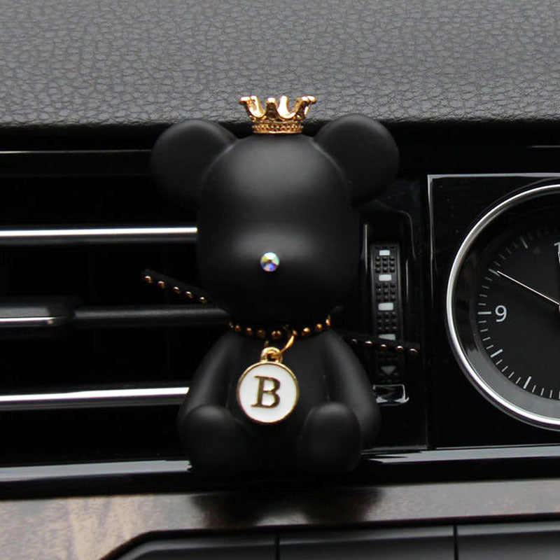 Car Air Vent Fragrance Clip in use — black bear clipped to a dashboard air vent
