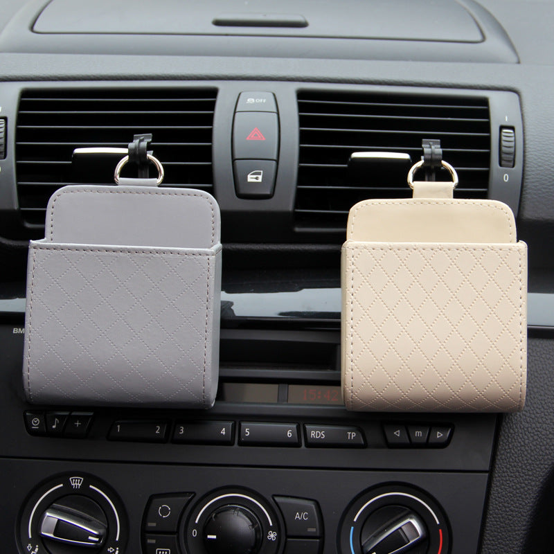 Hanging Car Vent Storage Bag in use — grey and beige bags hooked onto dashboard air vents