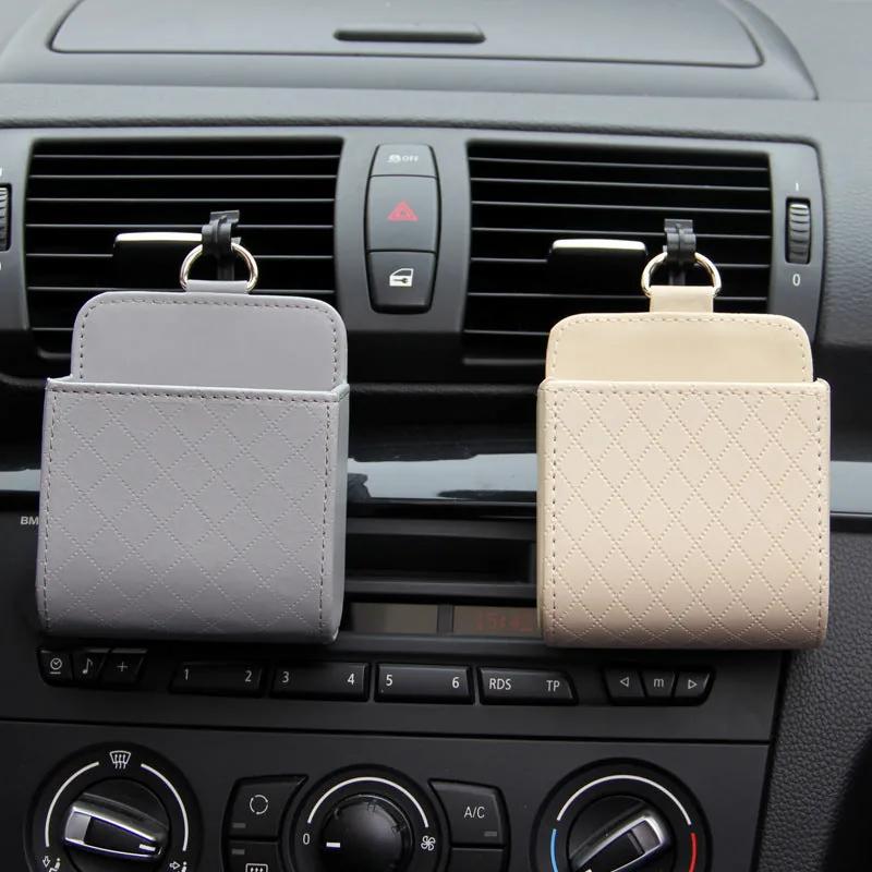 Hanging Car Vent Storage Bag in use — grey and beige bags hooked onto dashboard air vents